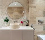 Modern and Mediterranean bathroom renovation with travertine